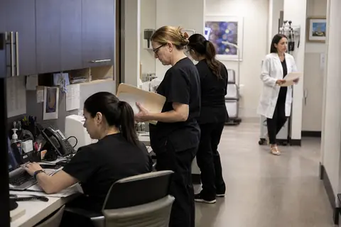 Dermatology practice staff managing patient and billing workflows