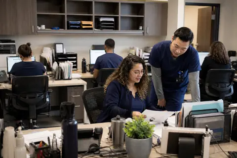 Hepatology practice staff managing patient and billing workflows