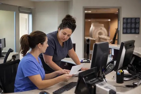 Neurology practice staff managing patient and billing workflows