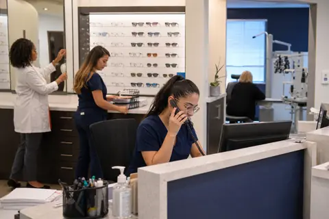 Optometry practice staff managing patient and billing workflows