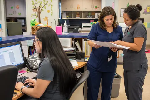 Pediatrics practice staff managing patient and billing workflows