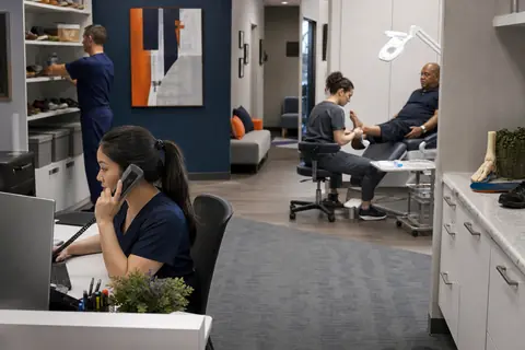 Podiatry practice staff managing patient and billing workflows